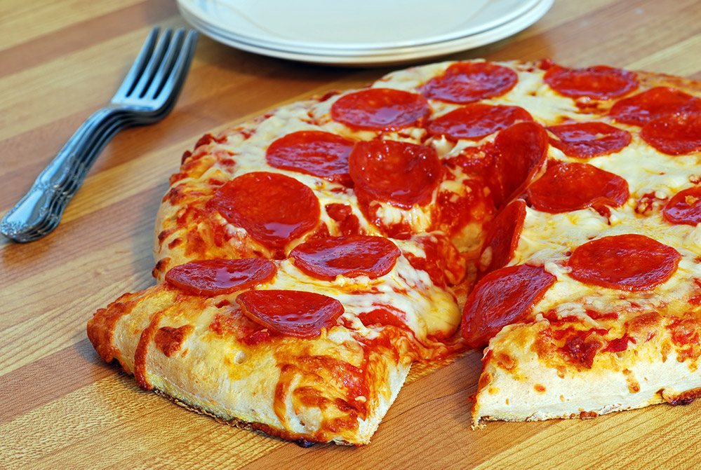 Pepperoni pizza slice plates forks